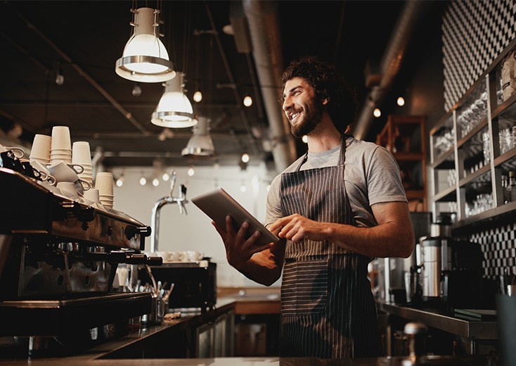 cafe owner on tablet